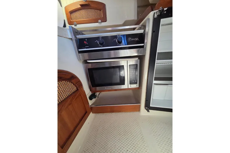 Slide: The Image of Compact kitchen area in a 2011 Hake Seaward 32RK sailboat with stove and microwave. - 24
