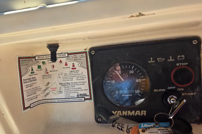 Slide: The Image of Control panel of a 2011 Hake Seaward 32RK boat with Yanmar gauge and boat handling guide. - 18