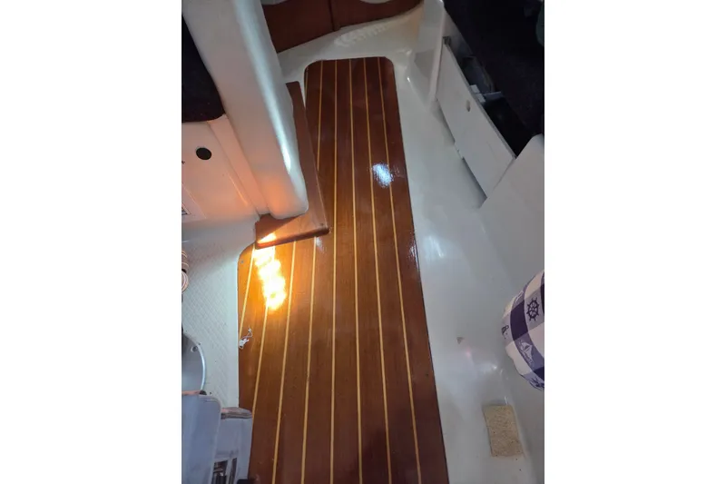 Slide: The Image of Interior view of a 2011 Hake Seaward 32RK sailboat with polished wooden flooring. - 40