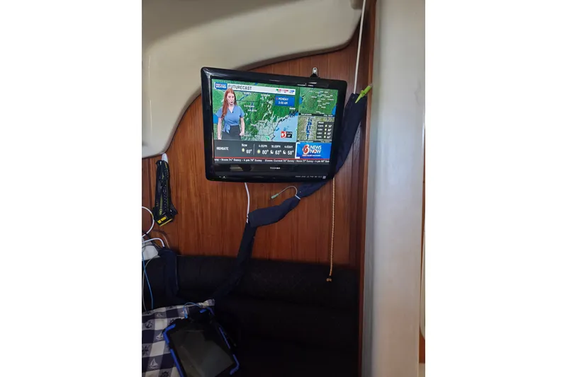 Slide: The Image of Weather forecast on TV inside 2011 Hake Seaward 32RK boat cabin. - 26