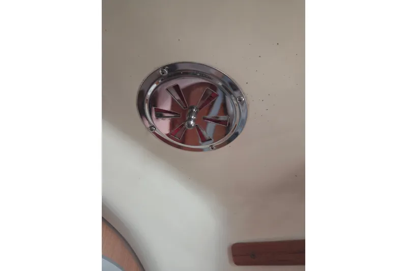 Slide: The Image of Chrome ceiling vent on 2011 Hake Seaward 32RK boat interior. - 43