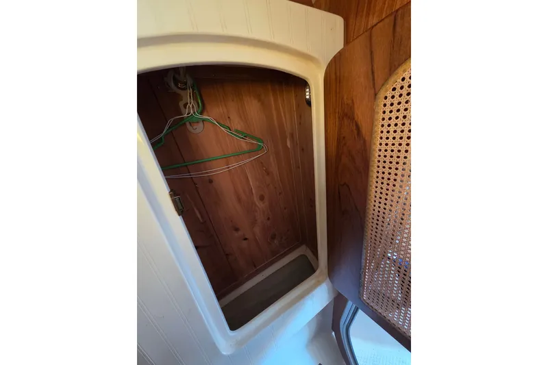 Slide: The Image of Wooden closet interior with hangers in a 2011 Hake Seaward 32RK boat. - 29