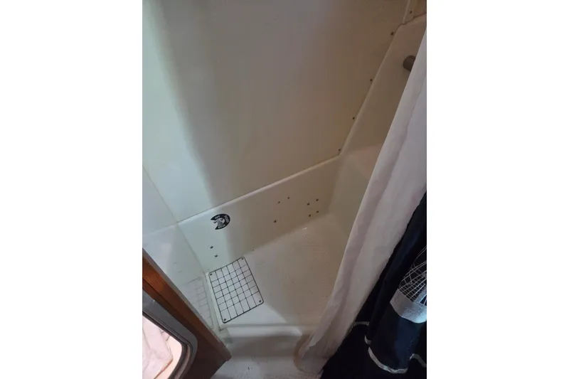 Slide: The Image of Shower area in 2011 Hake Seaward 32RK boat, featuring a compact design. - 31