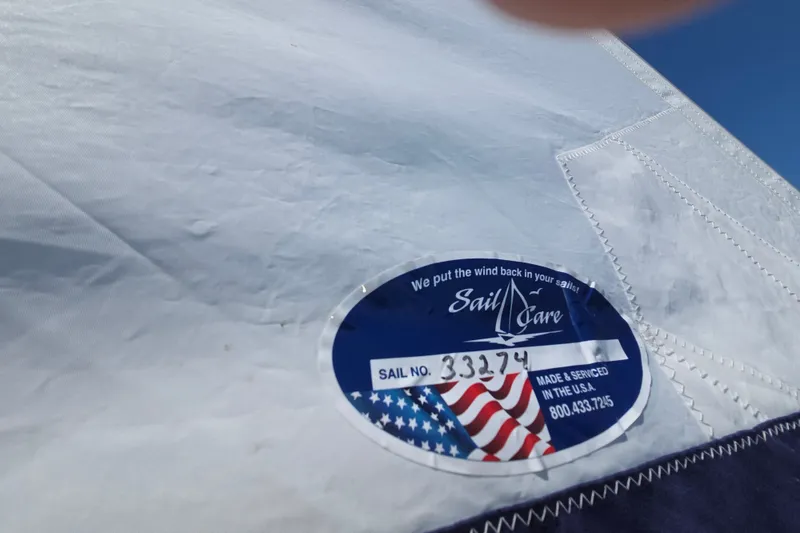 Slide: The Image of Sail with "Sail Care" label on Hake/Seaward 32RK, 2011 model, featuring American flag design. - 15