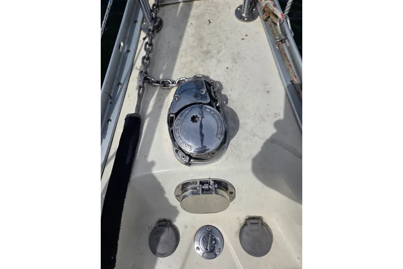 Slide: The Image of Anchor windlass on 2011 Hake Seaward 32RK sailboat deck, featuring chain and metal fittings. - 52