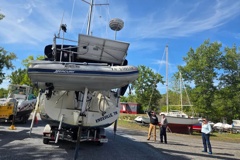 Slide: The Image of 2011 Hake Seaward 32RK sailboat on trailer, Knoxville TN, with people observing. - 58