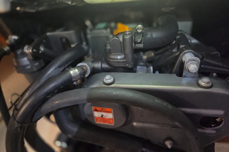 Slide: The Image of Close-up of a 2011 Hake Seaward 32RK engine components with hoses and bolts. - 46