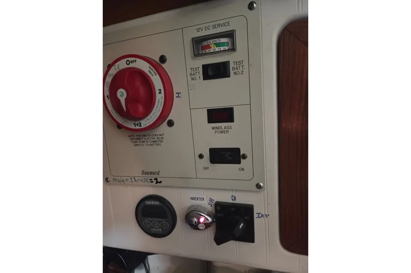 Slide: The Image of Control panel of a 2011 Hake Seaward 32RK boat with battery and power switches. - 38