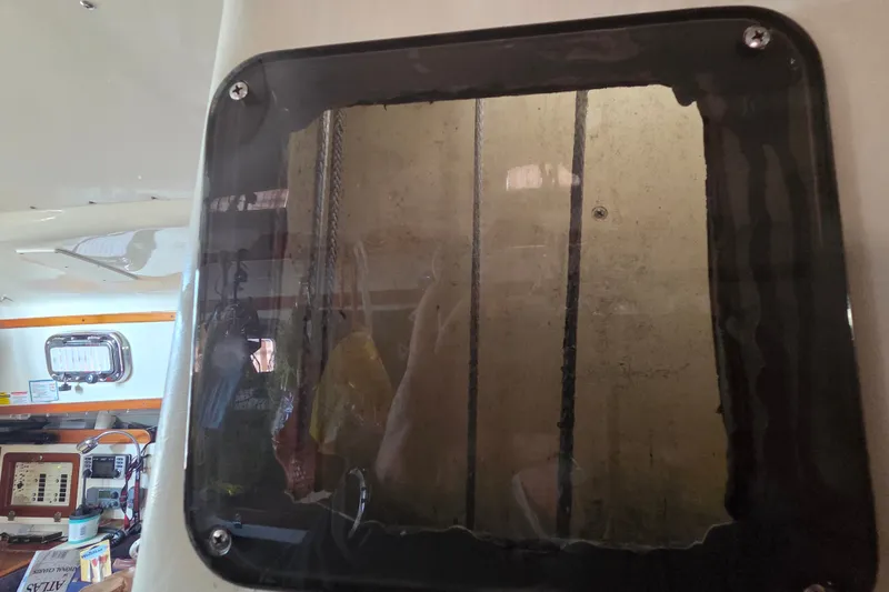 Slide: The Image of Interior view of a 2011 Hake Seaward 32RK sailboat, showcasing a window and control panel. - 35