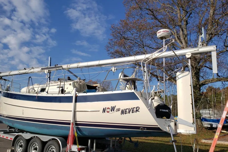 Slide: The Image of 2011 Hake Seaward 32RK sailboat on trailer under clear blue sky. - 57