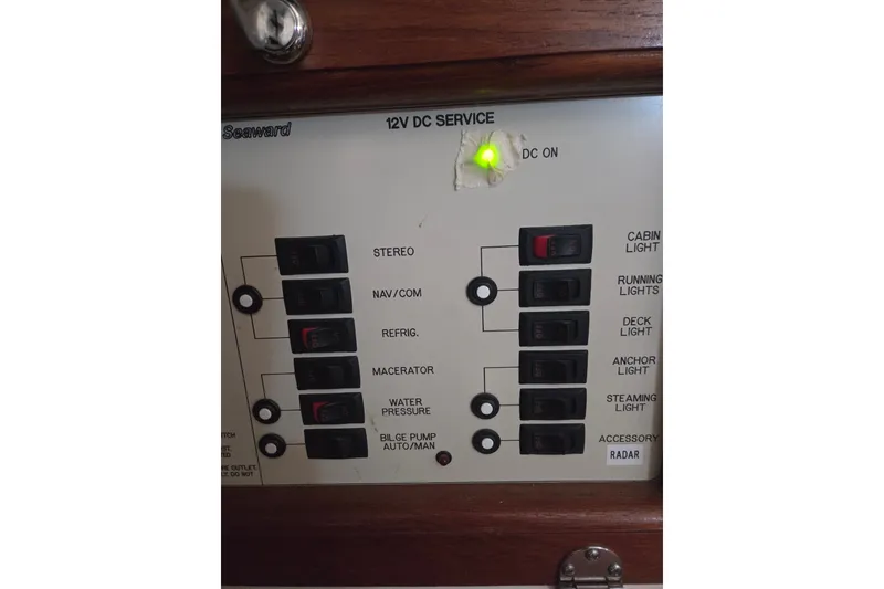 Slide: The Image of Control panel of a 2011 Hake Seaward 32RK boat with various switches and indicators. - 36