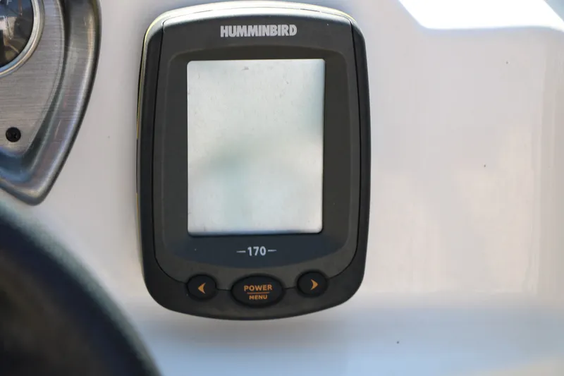 Slide: The Image of Humminbird 170 fish finder on 2013 NauticStar 223DC Sport Deck boat dashboard. - 46