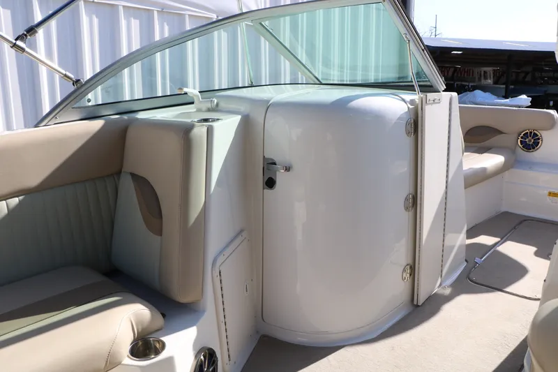Slide: The Image of 2013 NauticStar 223DC Sport Deck interior with beige seating and sleek design. - 37