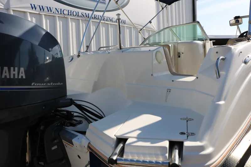 Slide: The Image of 2013 NauticStar 223DC Sport Deck boat with Yamaha four-stroke engine, docked at Nichols Marine. - 16