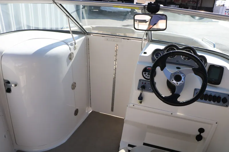 Slide: The Image of Interior view of 2013 NauticStar 223DC Sport Deck boat cockpit and steering wheel. - 44