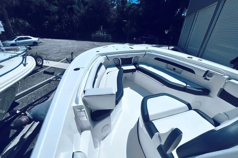 Slide: The Image of 2021 Tidewater 256 CC Adventure boat interior with spacious seating and modern design. - 19