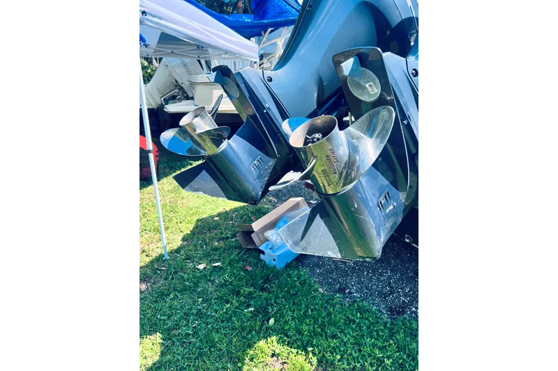 Slide: The Image of Twin propellers of a 2021 Tidewater 256 CC Adventure boat on grass. - 9