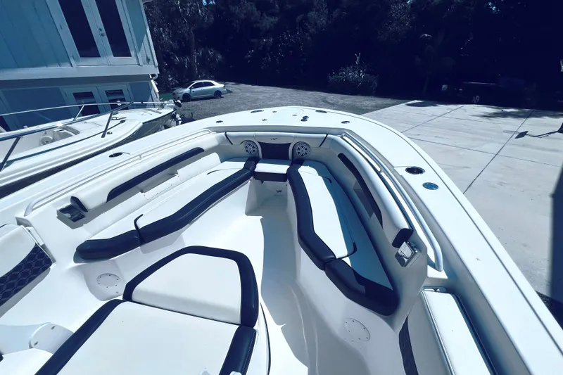 Slide: The Image of 2021 Tidewater 256 CC Adventure boat interior with spacious seating and modern design. - 15