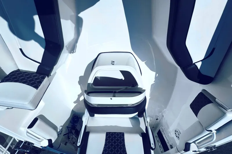 Slide: The Image of 2021 Tidewater 256 CC Adventure boat interior with sleek seating and modern design. - 24