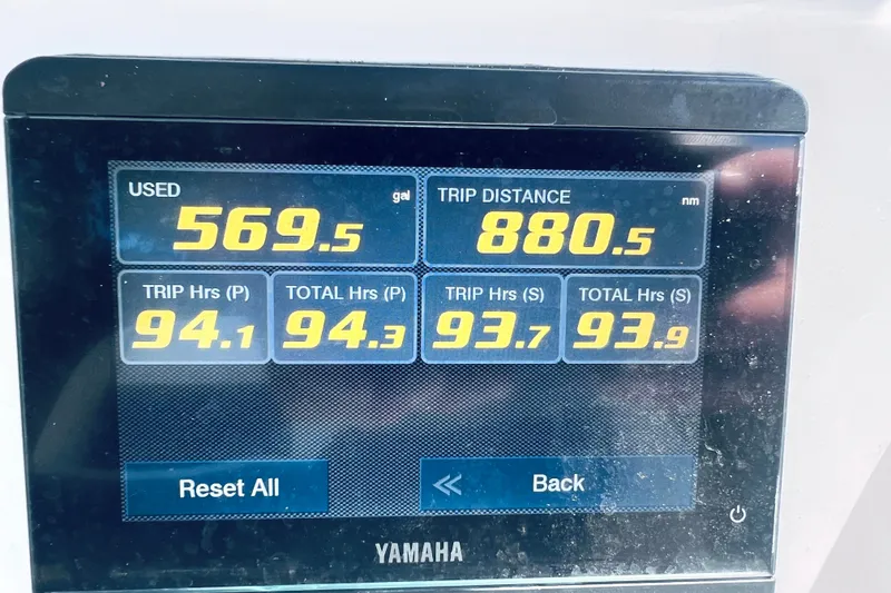 Slide: The Image of Yamaha display showing fuel usage and trip data for 2021 Tidewater 256 CC Adventure. - 34