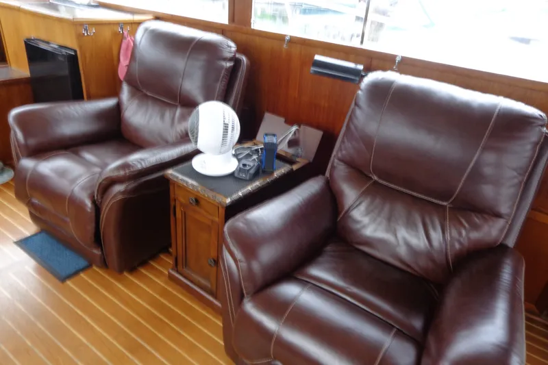 Slide: The Image of Luxurious leather seating in 1975 Uniflite Flybridge Sport Sedan interior. - 7