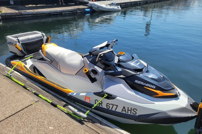 The Image of 2022 Sea-Doo FishPro Trophy 170 jet ski docked at a marina, ready for fishing adventures. - 3
