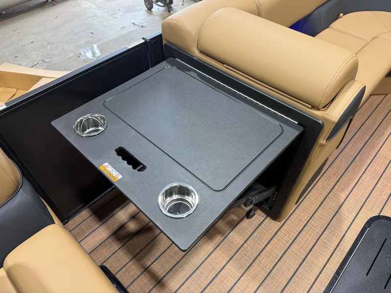 Slide: The Image of A sleek table with cup holders on a Bentley Pontoons Elite 223 Swingback Tritoon. - 32