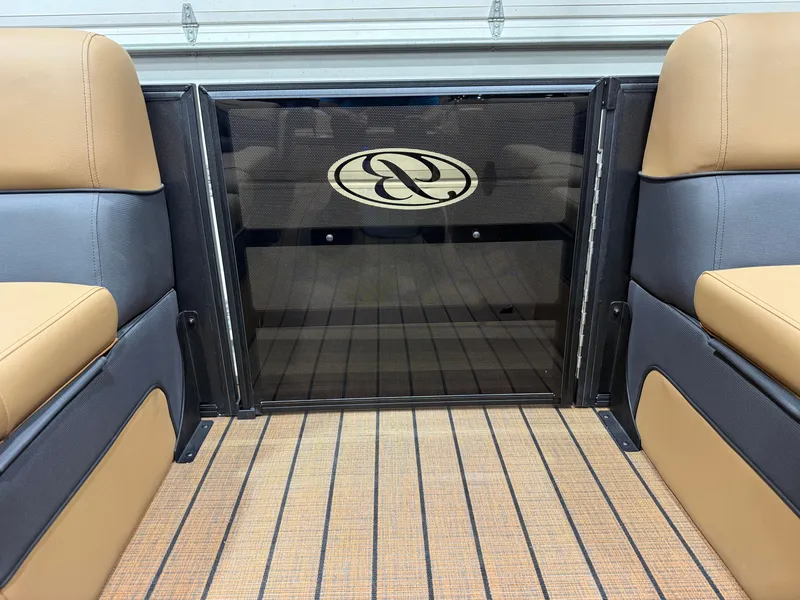 Slide: The Image of Interior of a Bentley Pontoons Elite 223 Swingback Tritoon with sleek seating and wood flooring. - 38