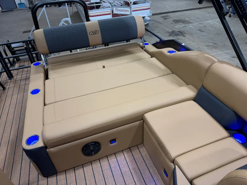 Slide: The Image of Luxurious lounging area on a Bentley Pontoons Elite 223 Swingback Tritoon, featuring blue LED lighting. - 21