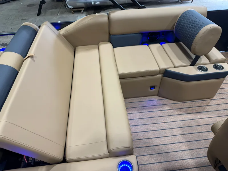 Slide: The Image of Luxurious seating area with beige upholstery and blue LED lights on a boat. - 17