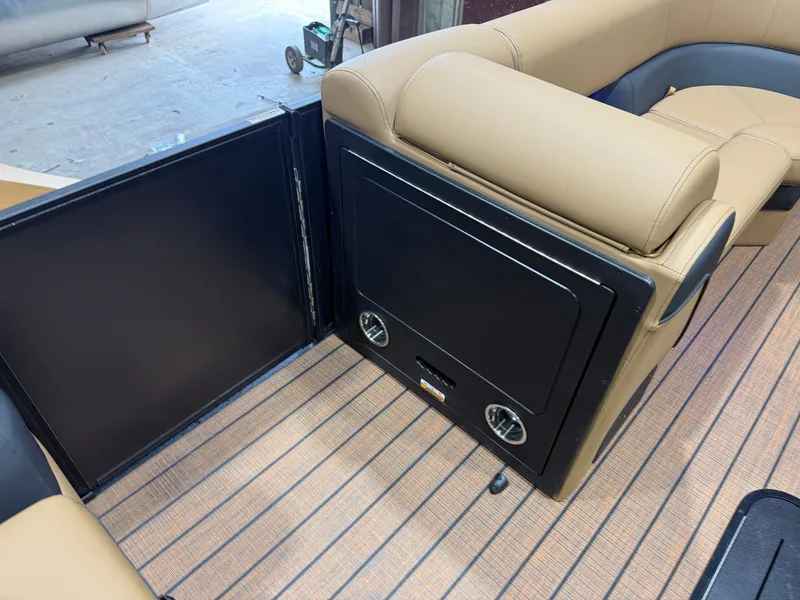 Slide: The Image of Interior view of a Bentley Pontoons Elite 223 Swingback Tritoon with sleek seating and wood flooring. - 31
