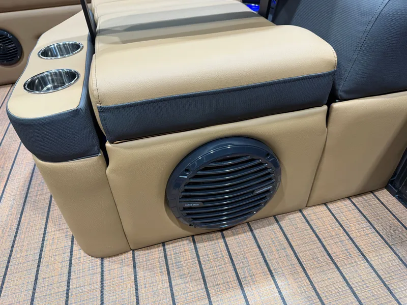 Slide: The Image of Close-up of a seating area with speaker and cup holders on a Bentley Pontoons Elite 223 Swingback Tritoon. - 33