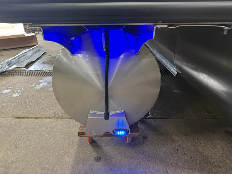 Slide: The Image of Close-up of a tritoon pontoon with blue lighting underneath. - 48