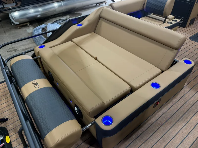 Slide: The Image of Luxurious seating area on a Bentley Pontoons Elite 223 Swingback Tritoon with blue LED cup holders. - 25