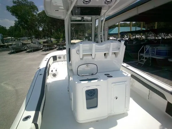 Slide: The Image of The image shows a modern boat with a central console and white seating. - 16