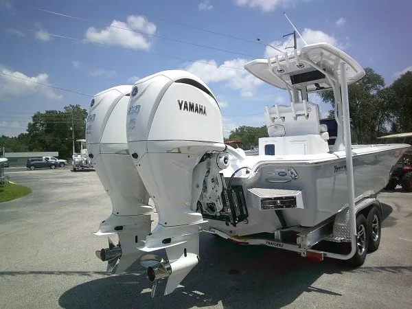 Slide: The Image of A Tidewater 2700 Carolina Bay boat with twin Yamaha outboard engines on a trailer. - 19