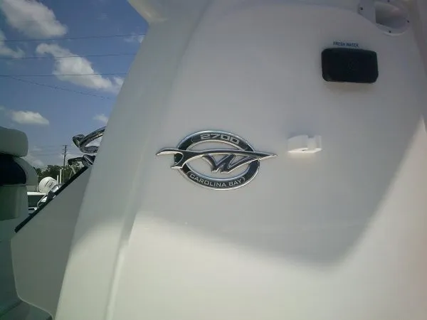 Slide: The Image of Close-up of a Tidewater 2700 Carolina Bay boat logo. - 17