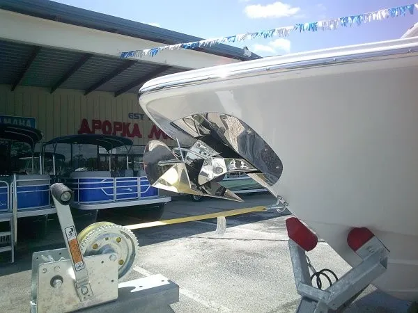 Slide: The Image of A 2027 Tidewater 2700 Carolina Bay boat is on a trailer in a covered area. - 25