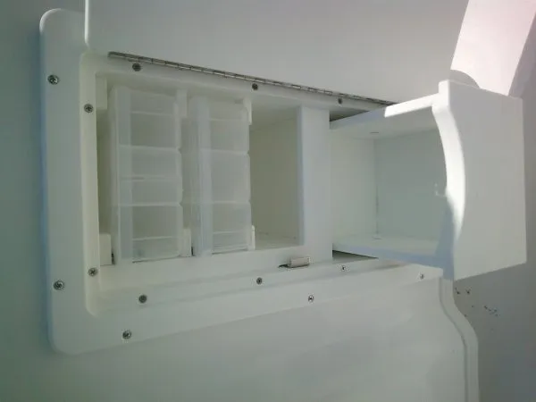 Slide: The Image of A white storage compartment with multiple sections on a boat. - 15