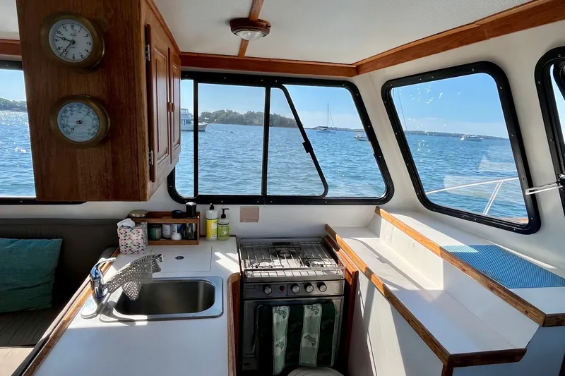 Slide: The Image of Interior of 1993 Atlantic Boat Flye Point 32 with kitchen and ocean view. - 21
