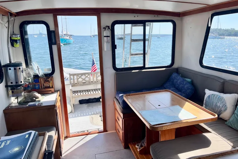 Slide: The Image of Interior of 1993 Atlantic Boat Flye Point 32 with ocean view and cozy seating area. - 22