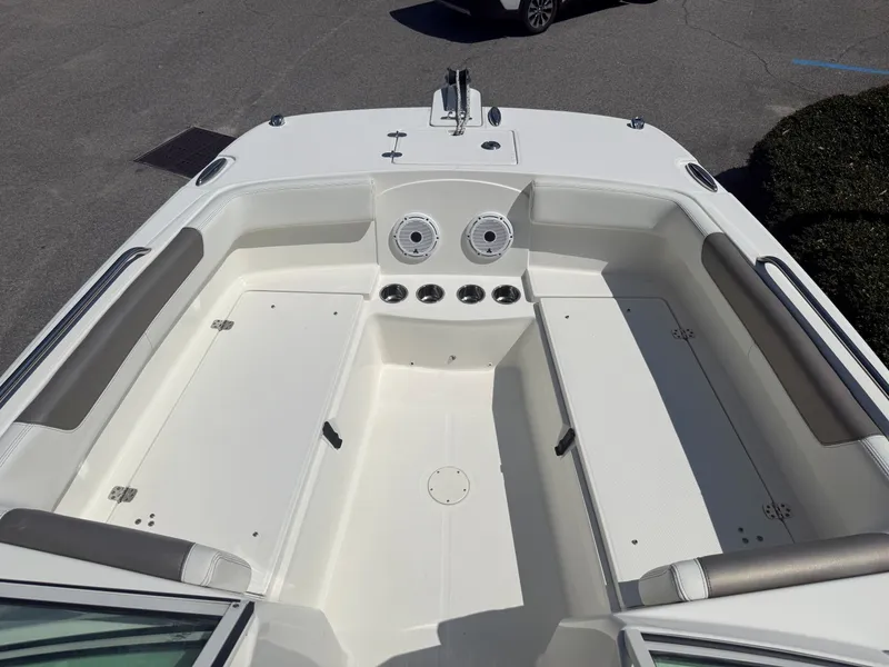 Slide: The Image of The image shows the spacious bow area of a 2023 World Cat 230 DC boat with seating. - 5