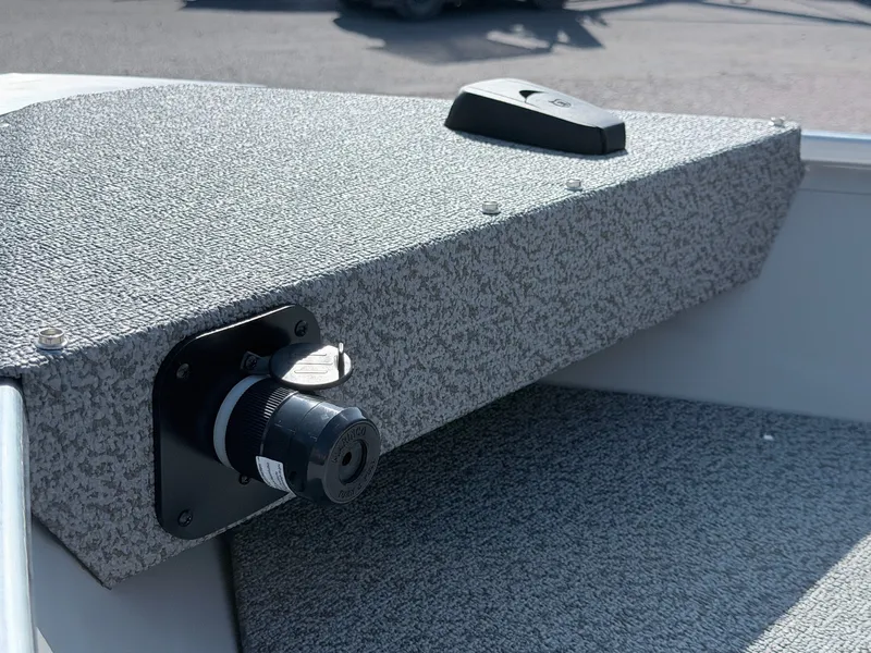 Slide: The Image of Close-up of a gray boat deck with a black fitting and a handle. - 27