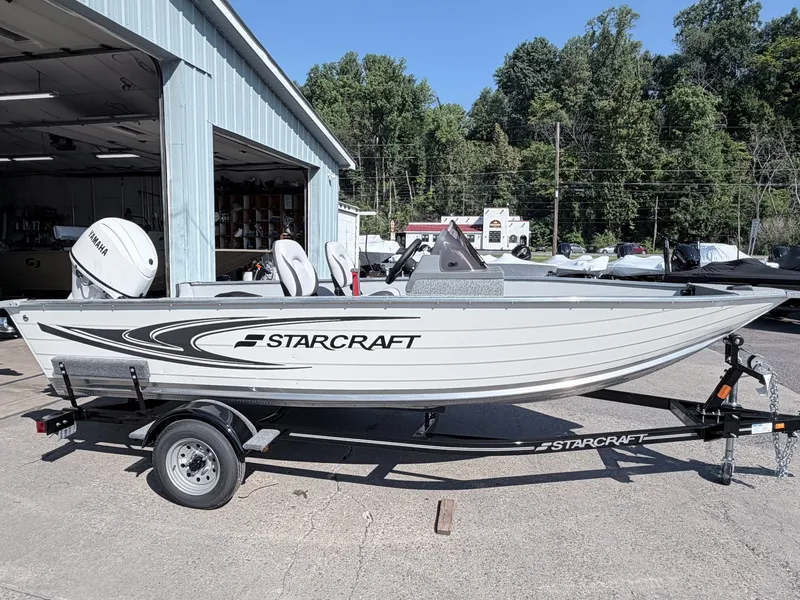 The Image of The image shows a 2027 Starcraft 16 Patriot DLX SC boat on a trailer. - 1