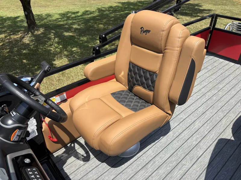 Slide: The Image of Luxurious captain's chair on a Ranger 223FC boat, featuring padded leather and stylish stitching. - 16