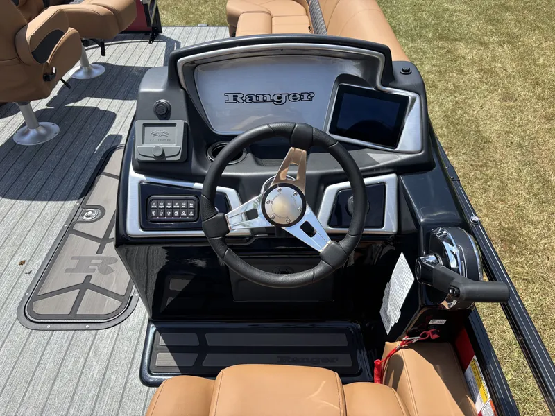 Slide: The Image of The image shows the helm of a Ranger Fish and Cruise Series 223FC boat with modern controls. - 19