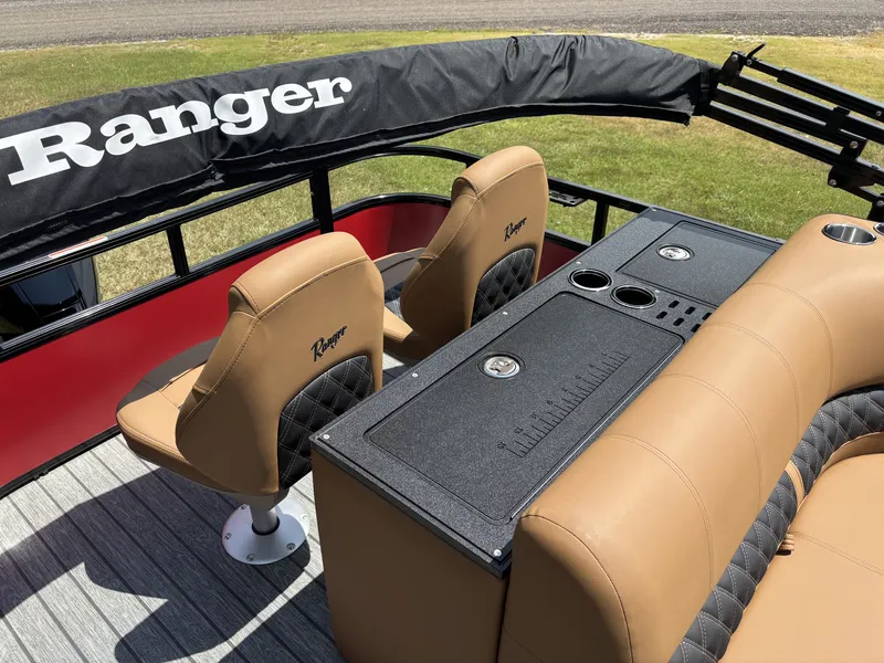 Slide: The Image of The image shows the interior of a Ranger Fish and Cruise Series 223FC boat with beige seats and a table. - 17