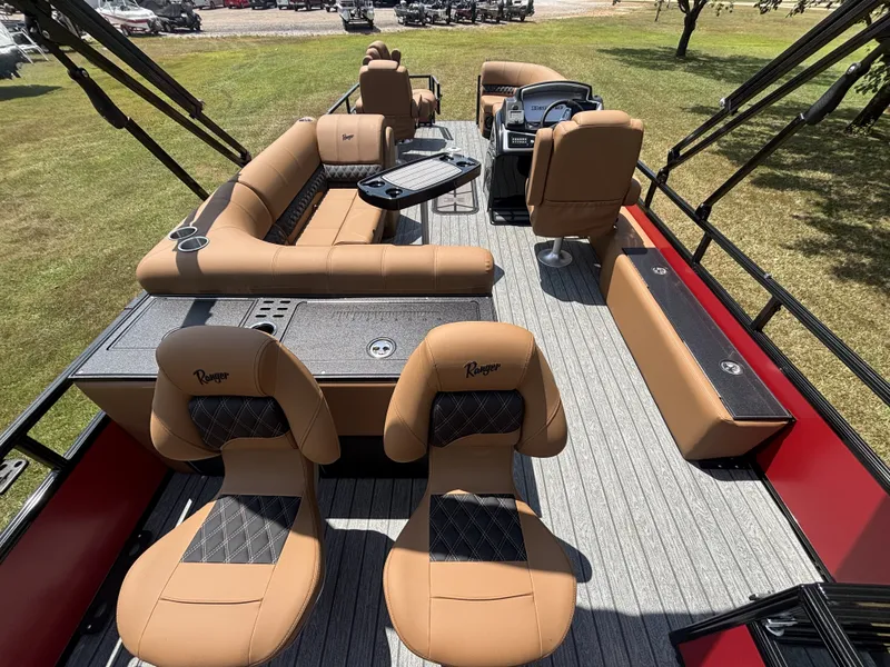 Slide: The Image of The image shows the interior of a 2026 Ranger Fish and Cruise Series 223FC boat with beige seating and a modern helm. - 18