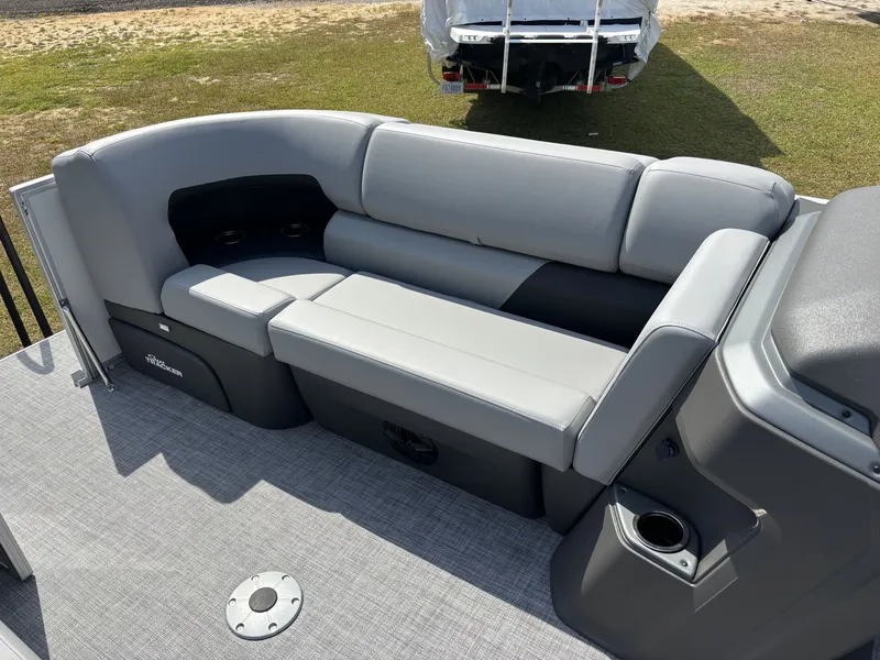 Slide: The Image of The image shows a gray seating area on a boat with cup holders and gray flooring. - 16