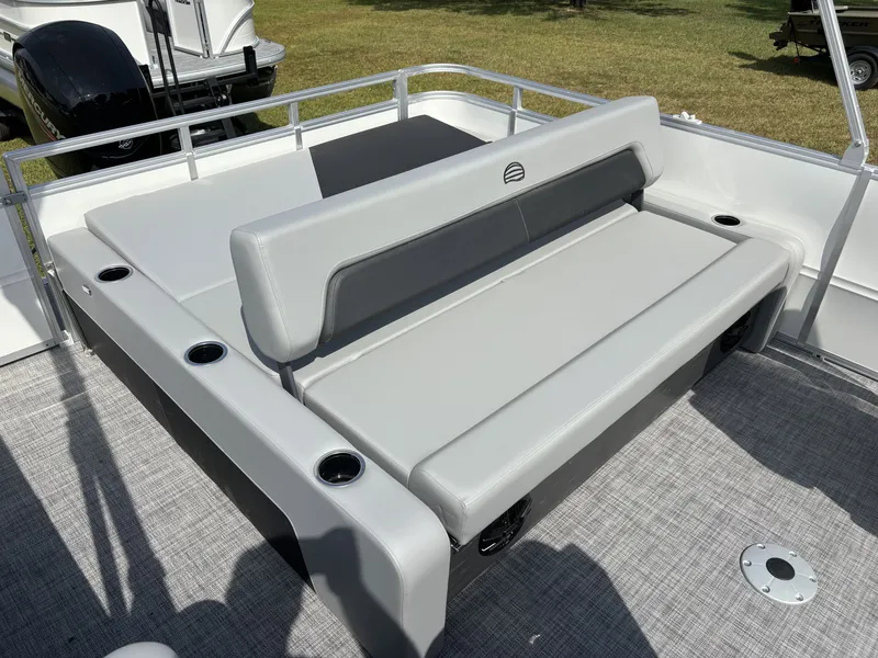 Slide: The Image of The image shows a gray seating area on a 2026 Sun Tracker Party Barge 22 RF DLX. - 15